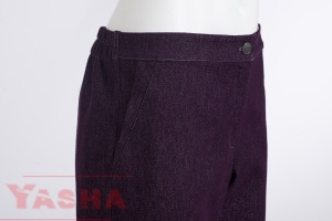Flat front waistband and metal button on purple denim trousers