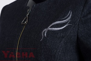 Rounded neckline and front zip with a triangular pull on the navy denim jacket